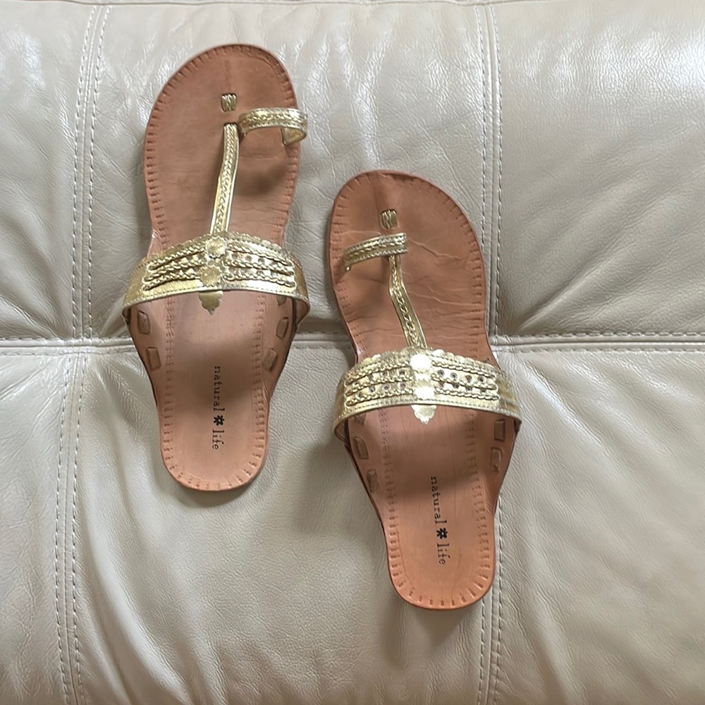 A boho gold sandal.